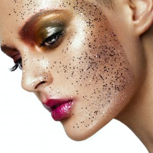 Close up of woman face with glitter on face